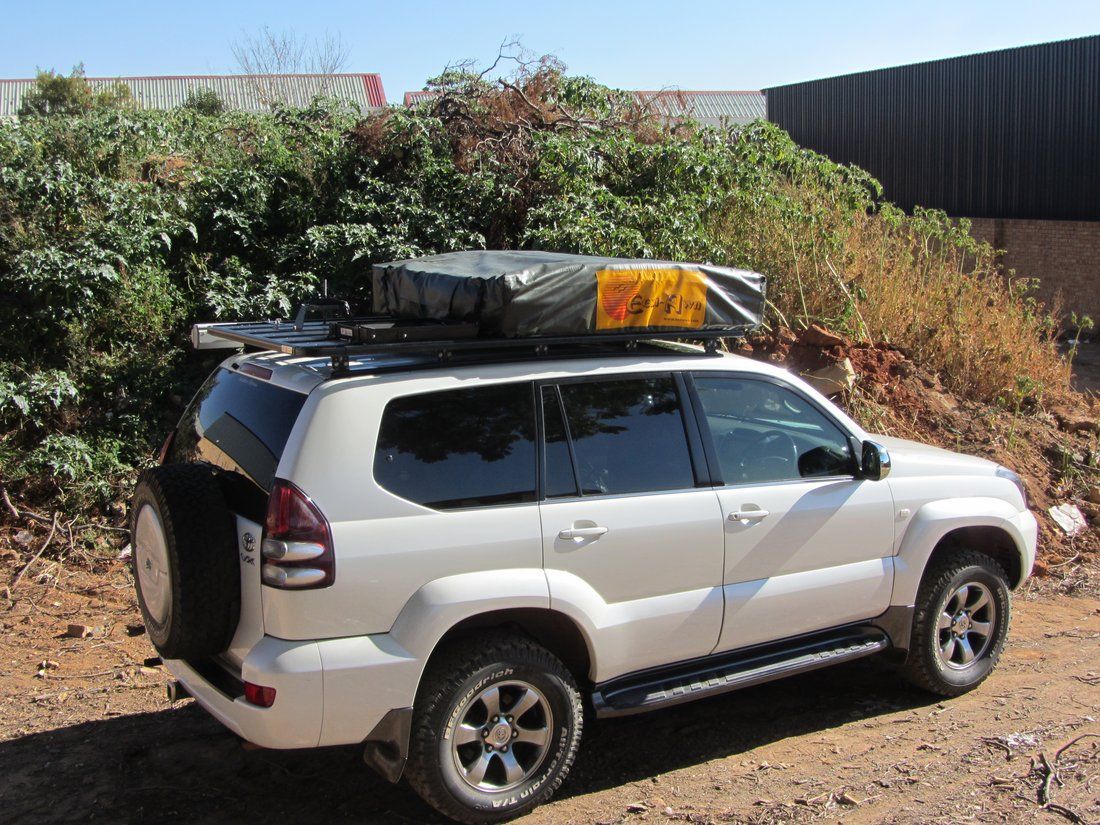 Land cruiser car rental with single roof top tent