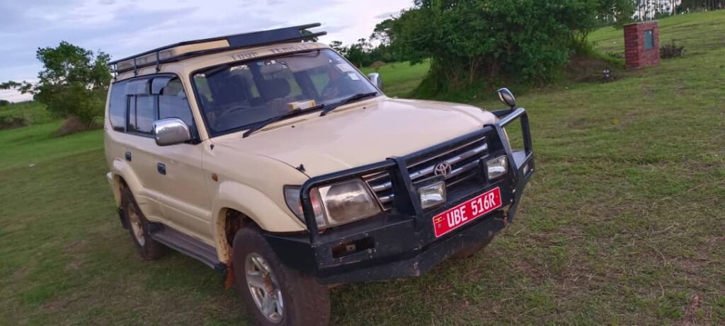 Land cruiser car rental with a pop up roof in Uganda